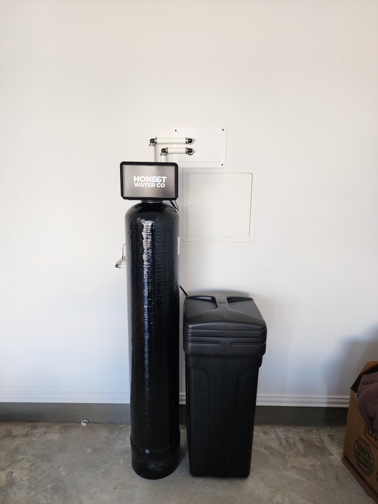 Whole-home water system installed beside the water heater in an Ottawa home