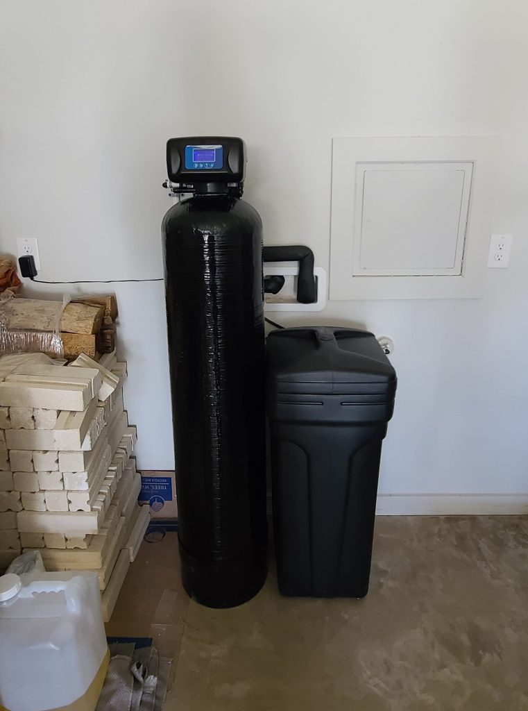 Softener and filtration pair installed in an Ottawa mechanical room